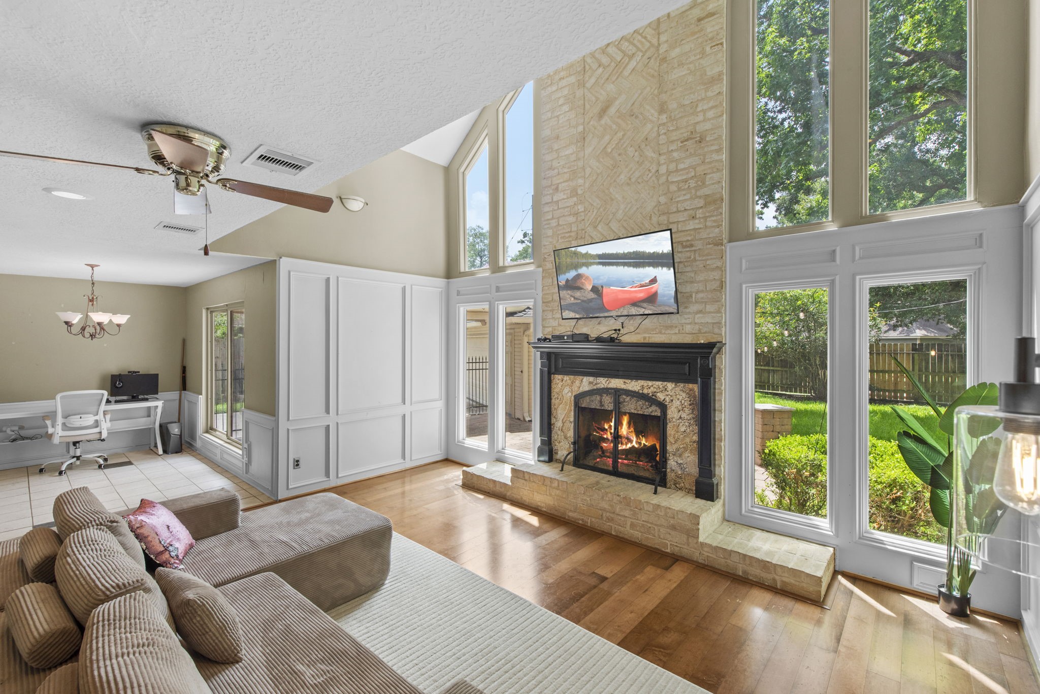 5507 Glenmere Lane Spring, TX 77379 - Photo 10 of 37 a living room with furniture and a fireplace