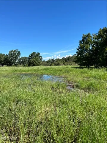 a view of an ocean with a yard