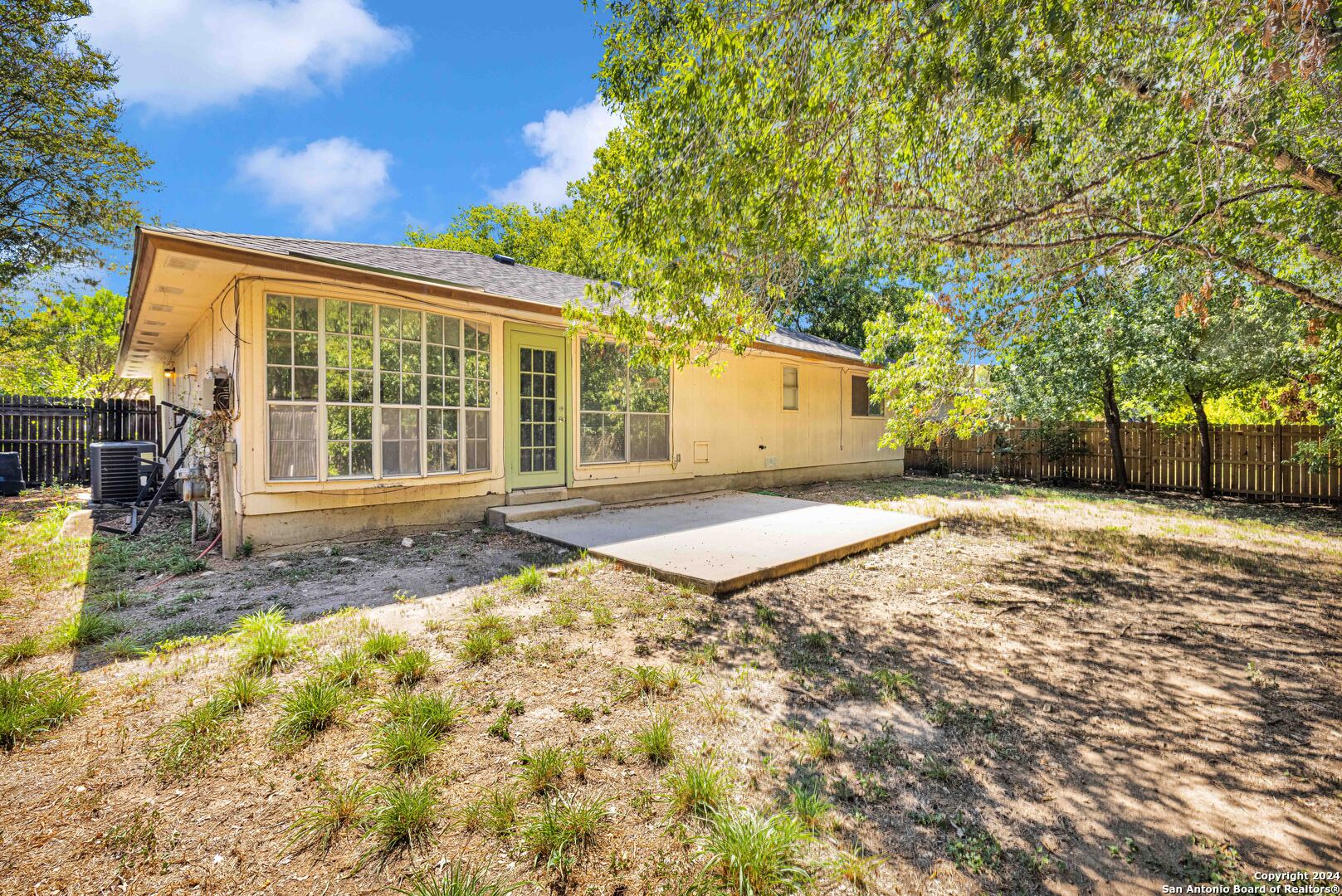6427 Ridge Pl Street San Antonio, TX 78250 - Photo 12 of 14 a front view of a house with a yard