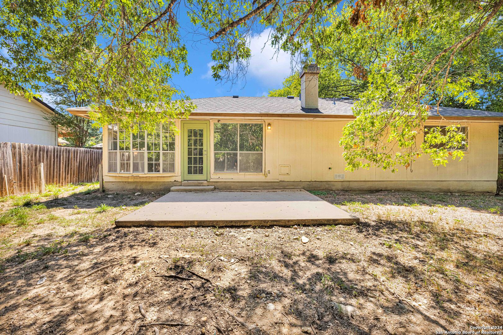 6427 Ridge Pl Street San Antonio, TX 78250 - Photo 13 of 14 a front view of a house with a yard