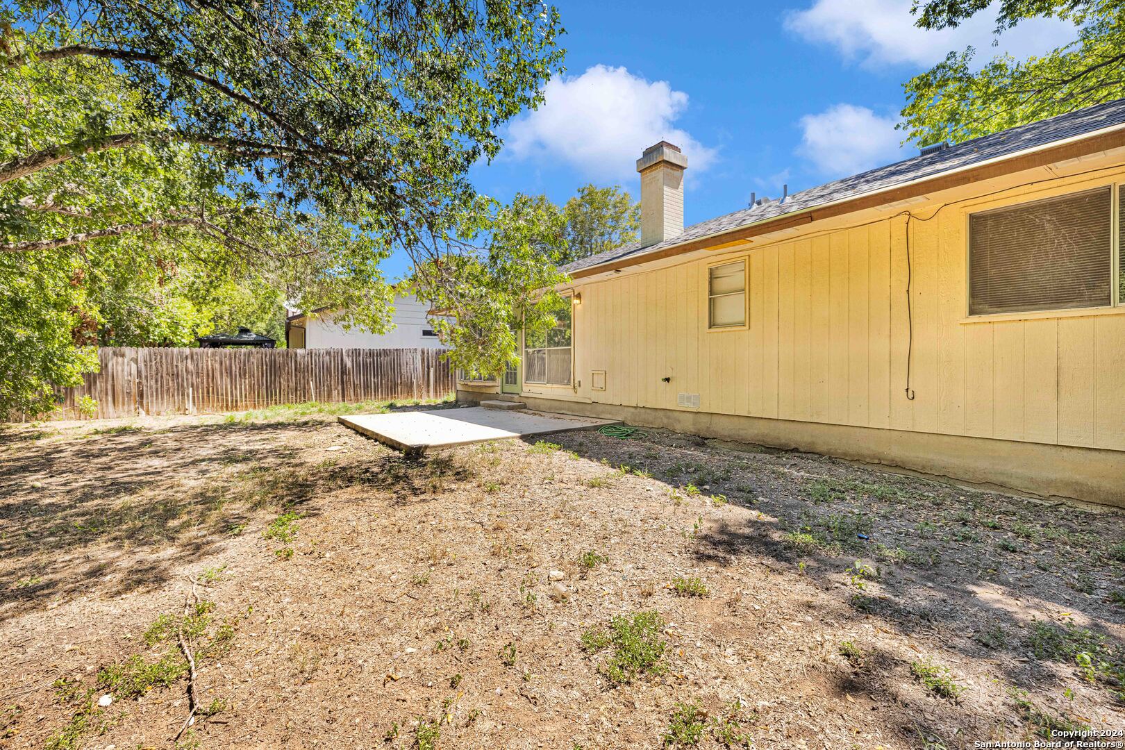 6427 Ridge Pl Street San Antonio, TX 78250 - Photo 14 of 14 a view of a backyard of the house
