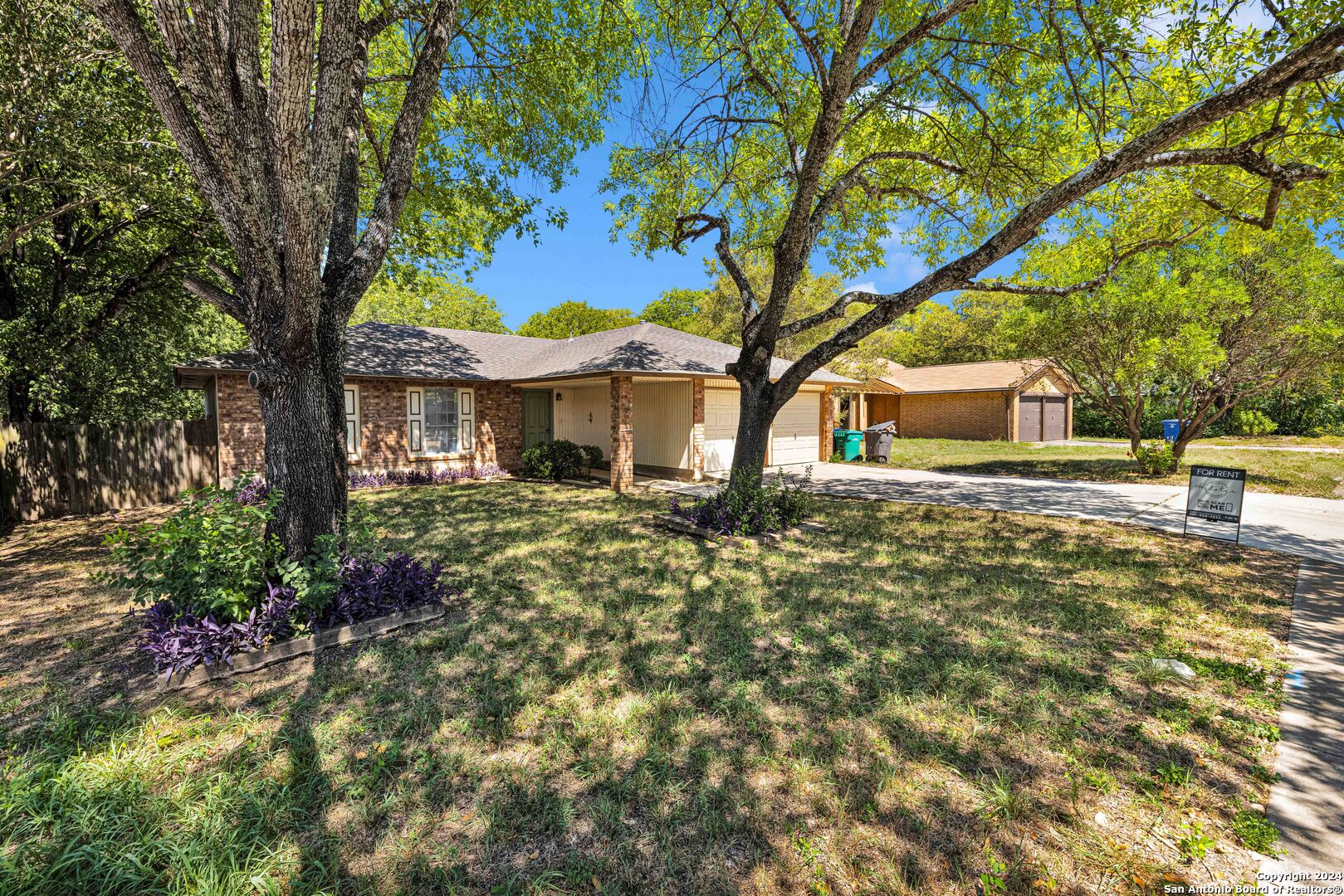 6427 Ridge Pl Street San Antonio, TX 78250 - Photo 2 of 14 a front view of a house with a yard