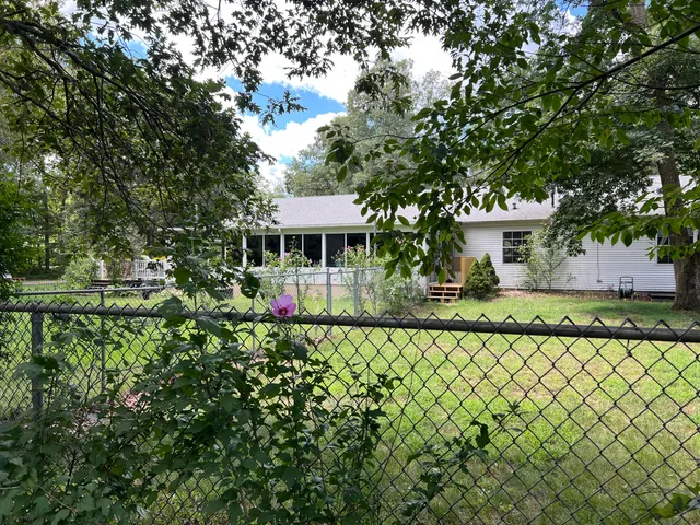 a backyard of a house with lots of green space