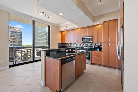a kitchen with a sink cabinets and window