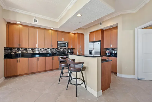 a dining table chair next to a window