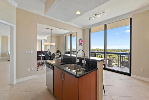a kitchen with a sink and a large window