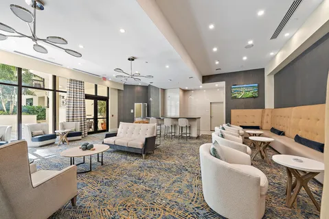 a swimming pool with outdoor seating and yard