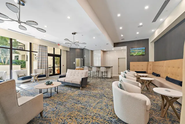 a swimming pool with outdoor seating and yard