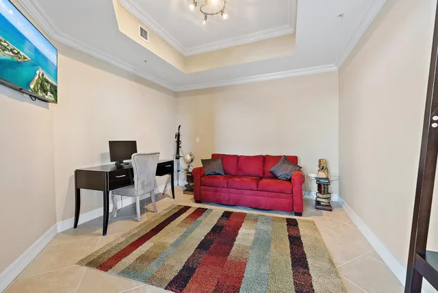a living room with furniture and a rug