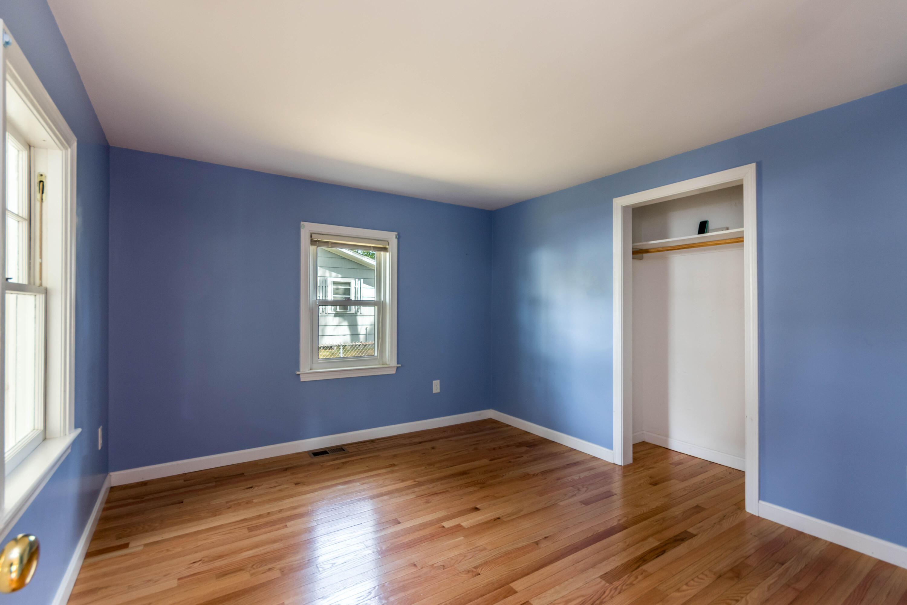 19 Monack Road Wareham, MA 02532 - Photo 12 of 24 a view of an empty room with wooden floor and a window