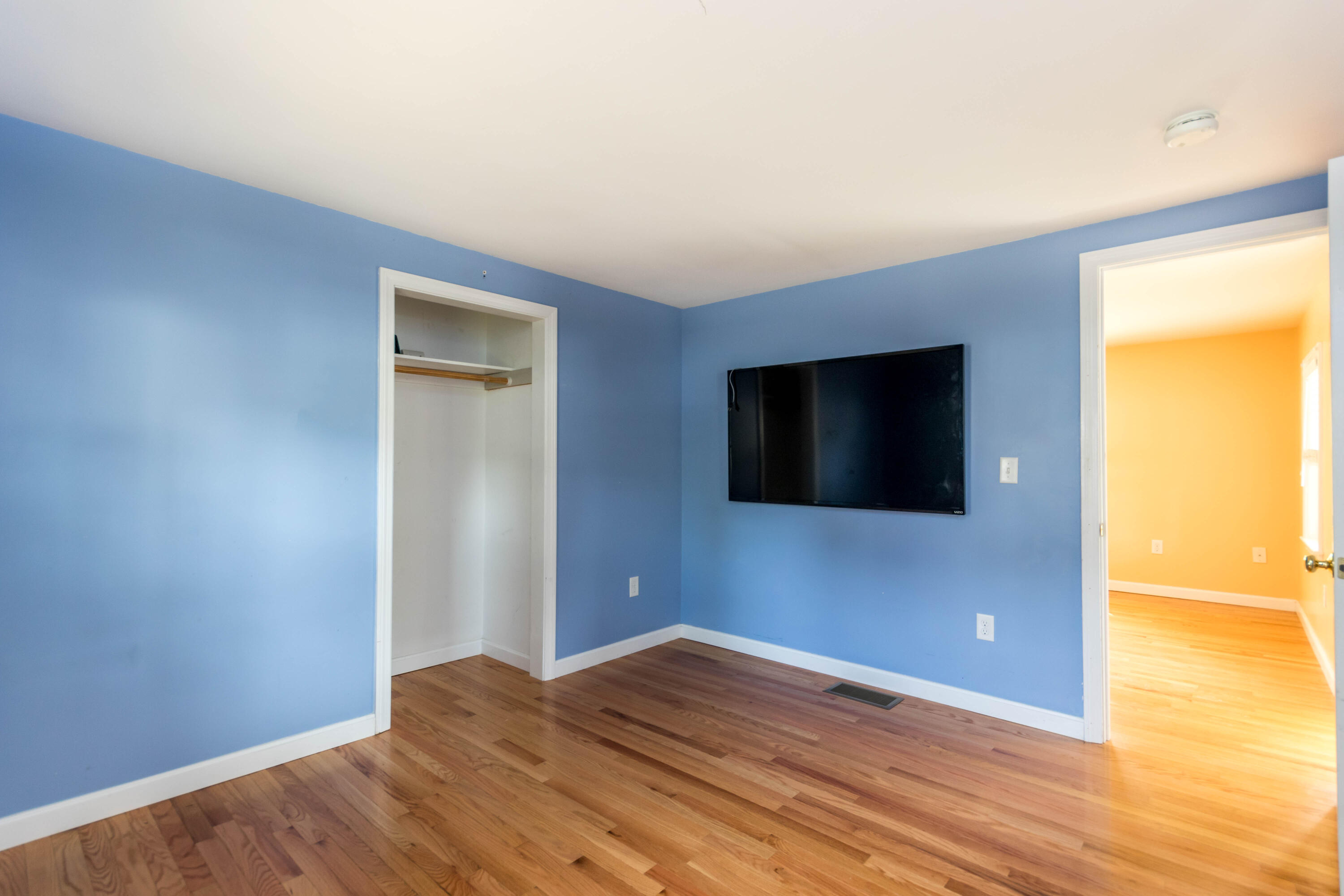 19 Monack Road Wareham, MA 02532 - Photo 13 of 24 a view of a livingroom with wooden floor and a flat screen tv