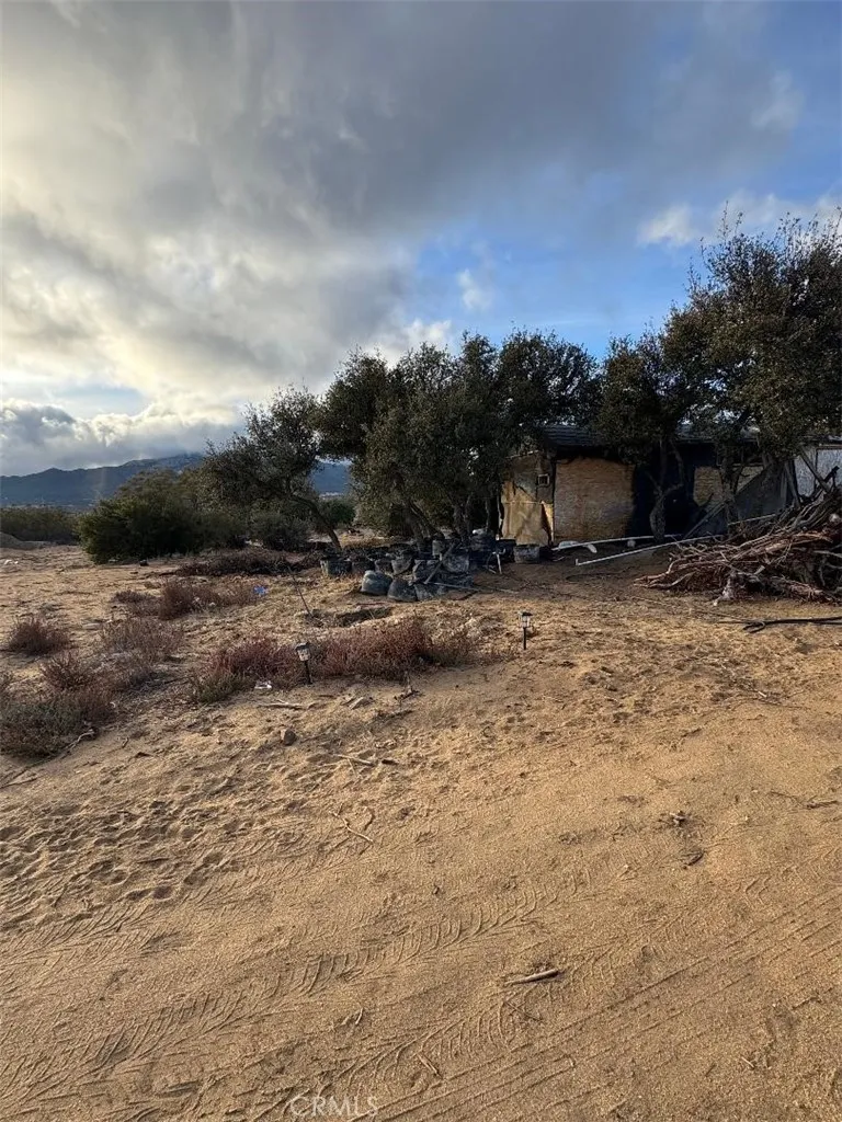 0 Glasgow Road Riverside, CA 92507 - Photo 3 of 12 a view of a dry yard with wooden fence