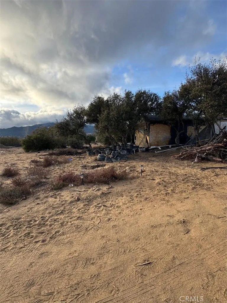 0 Glasgow Road Riverside, CA 92521 - Photo 3 of 12 a view of a dry yard with wooden fence
