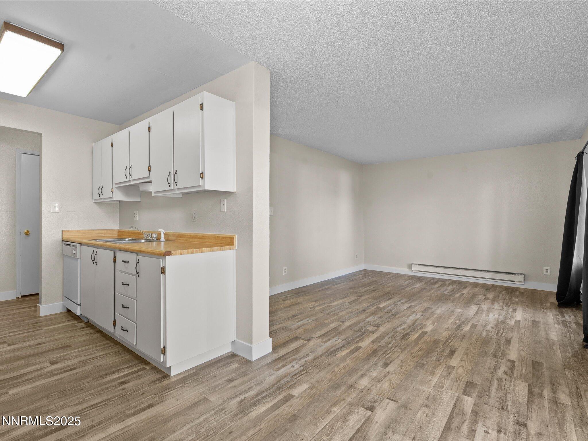 3935 Clear Acre Lane, Unit 215 Reno, NV 89512 - Photo 15 of 31 a view of kitchen with wooden floor
