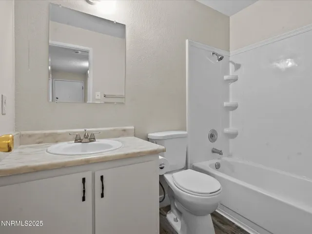 a bathroom with a bathtub and a toilet