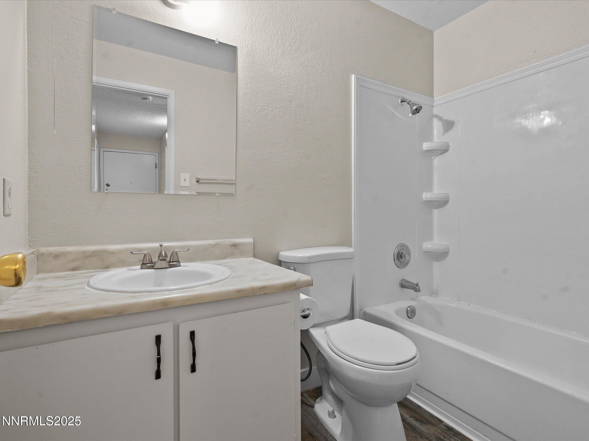 3935 Clear Acre Lane, Unit 215 Reno, NV 89512 - Photo 25 of 31 a bathroom with a sink toilet and shower