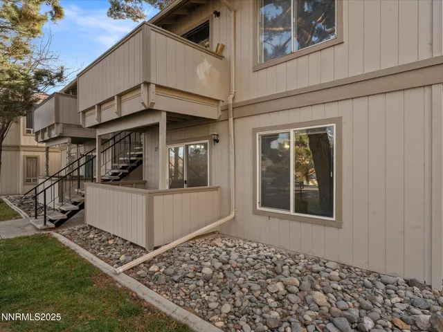 a view of a house with a door and a window