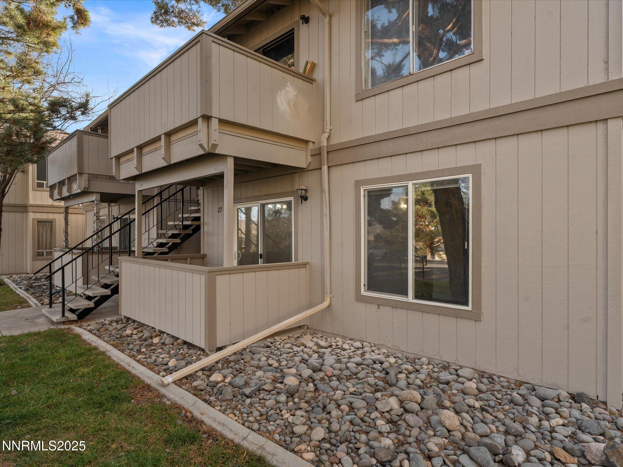 3935 Clear Acre Lane, Unit 215 Reno, NV 89512 - Photo 4 of 31 a view of a house with a door and a window