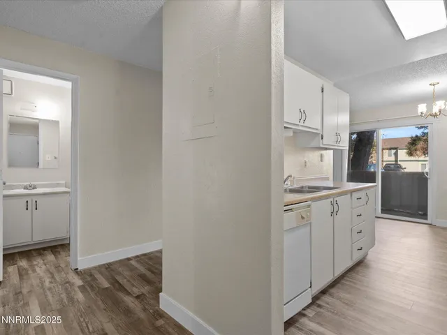 a kitchen with stainless steel appliances granite countertop a sink and a stove