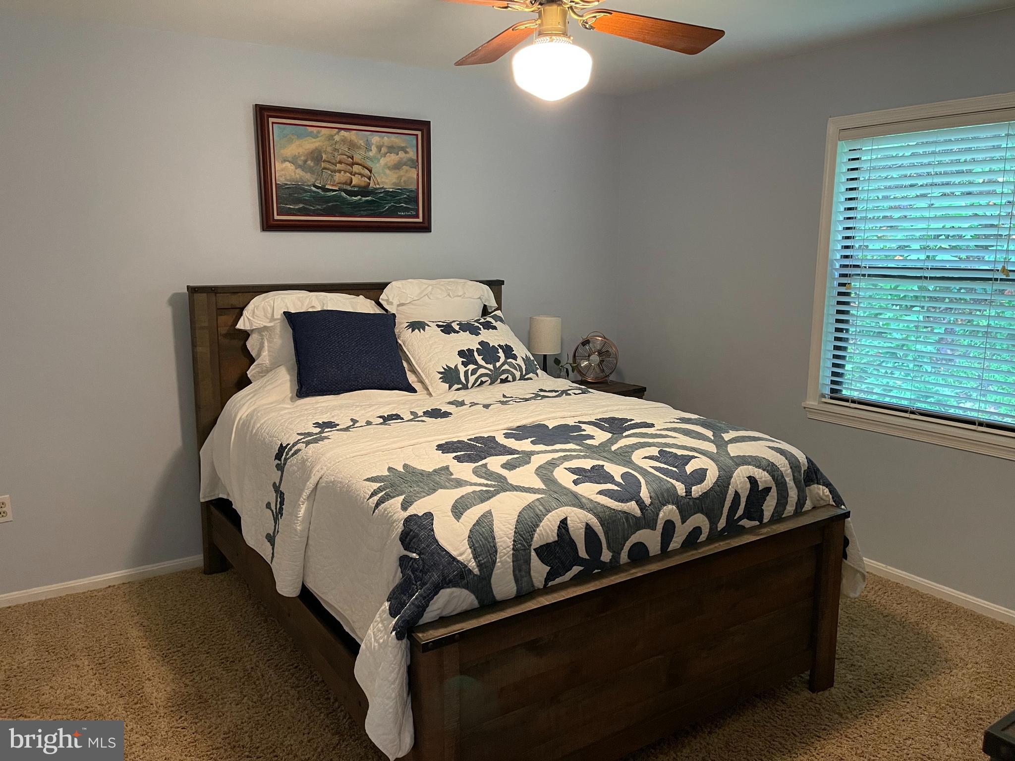 2315 Lookout Road Haymarket, VA 20169 - Photo 24 of 36 a bed sitting in a bedroom next to a window