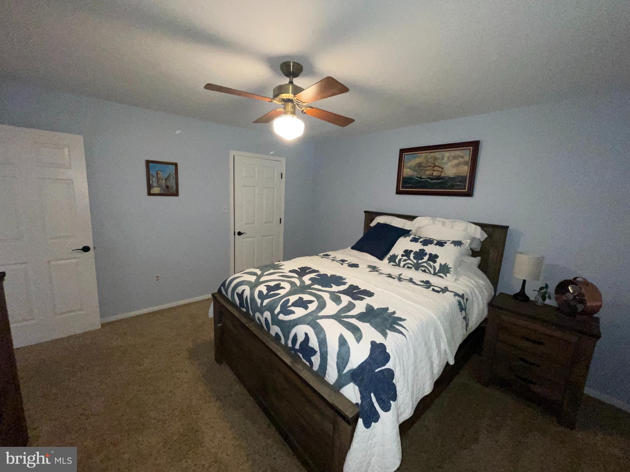 2315 Lookout Road Haymarket, VA 20169 - Photo 25 of 36 a bedroom with a bed and a chandelier