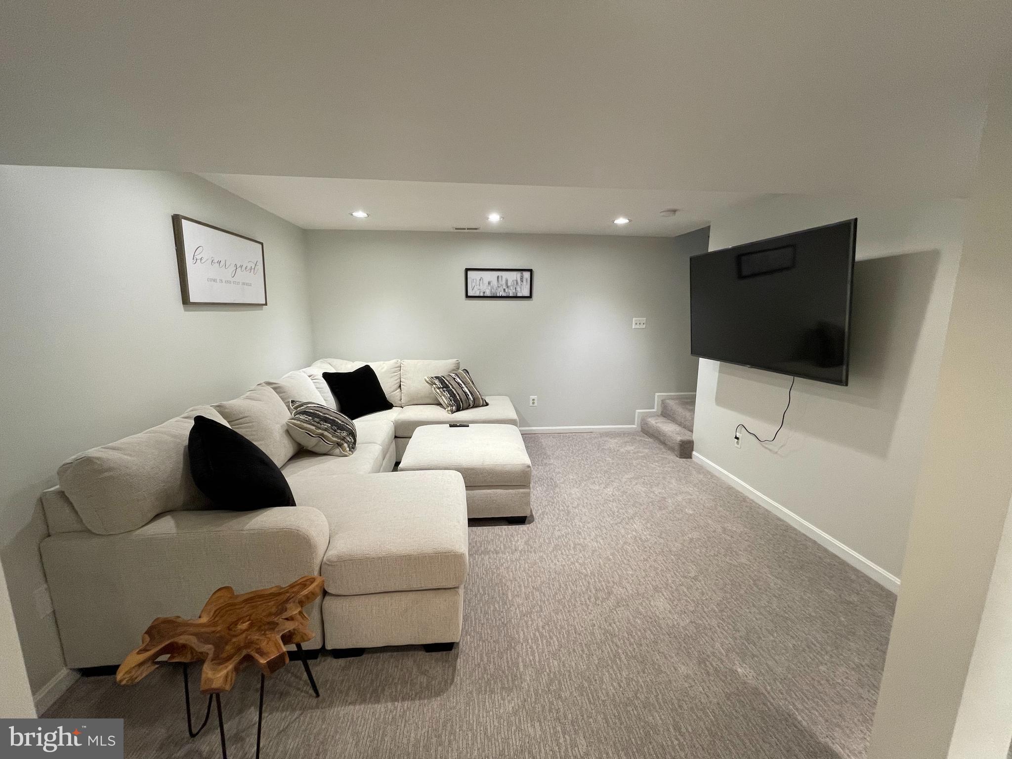 2315 Lookout Road Haymarket, VA 20169 - Photo 30 of 36 a living room with furniture and a flat screen tv