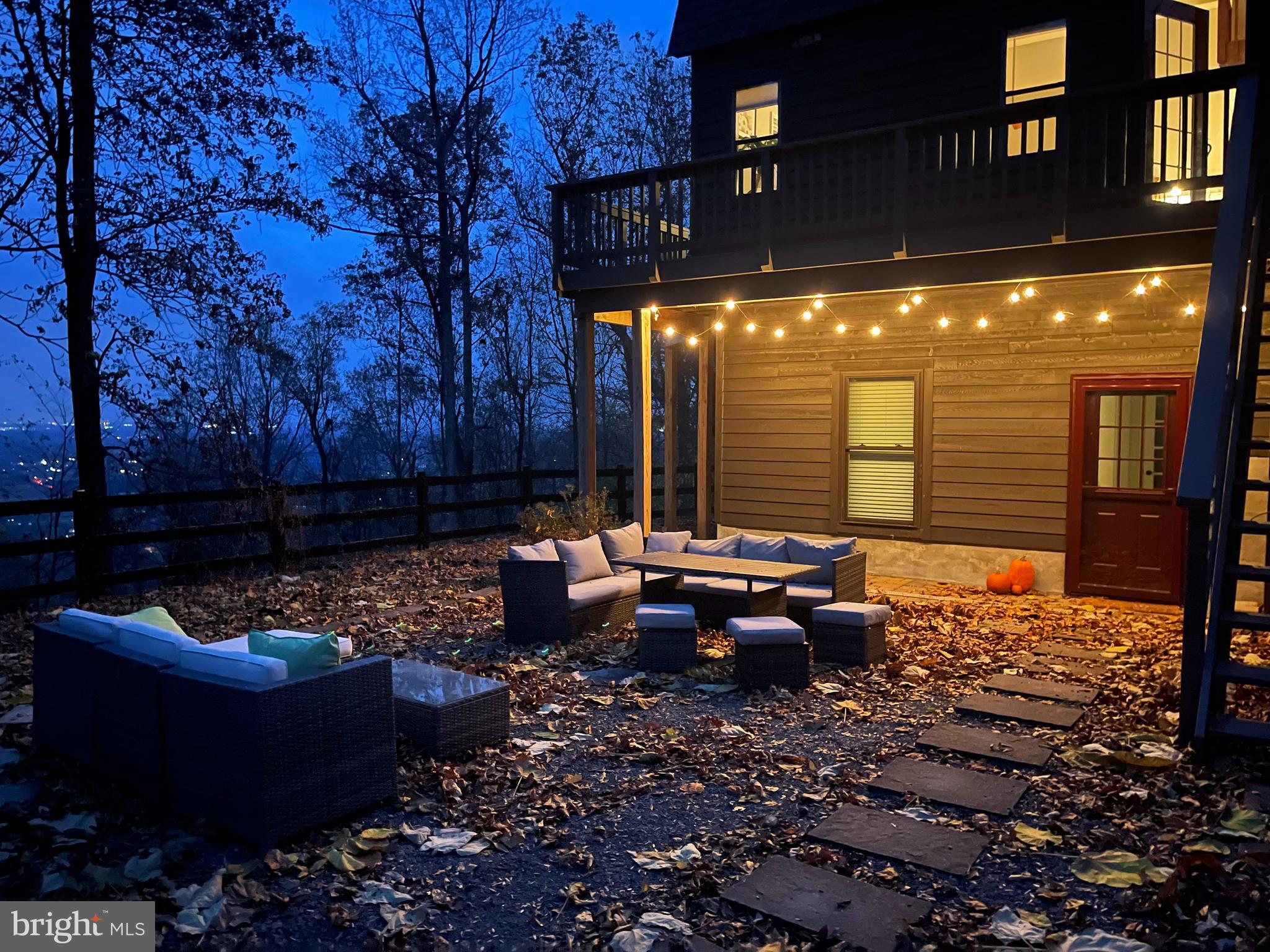 2315 Lookout Road Haymarket, VA 20169 - Photo 4 of 36 a view of a chairs and fire pit in backyard of the house