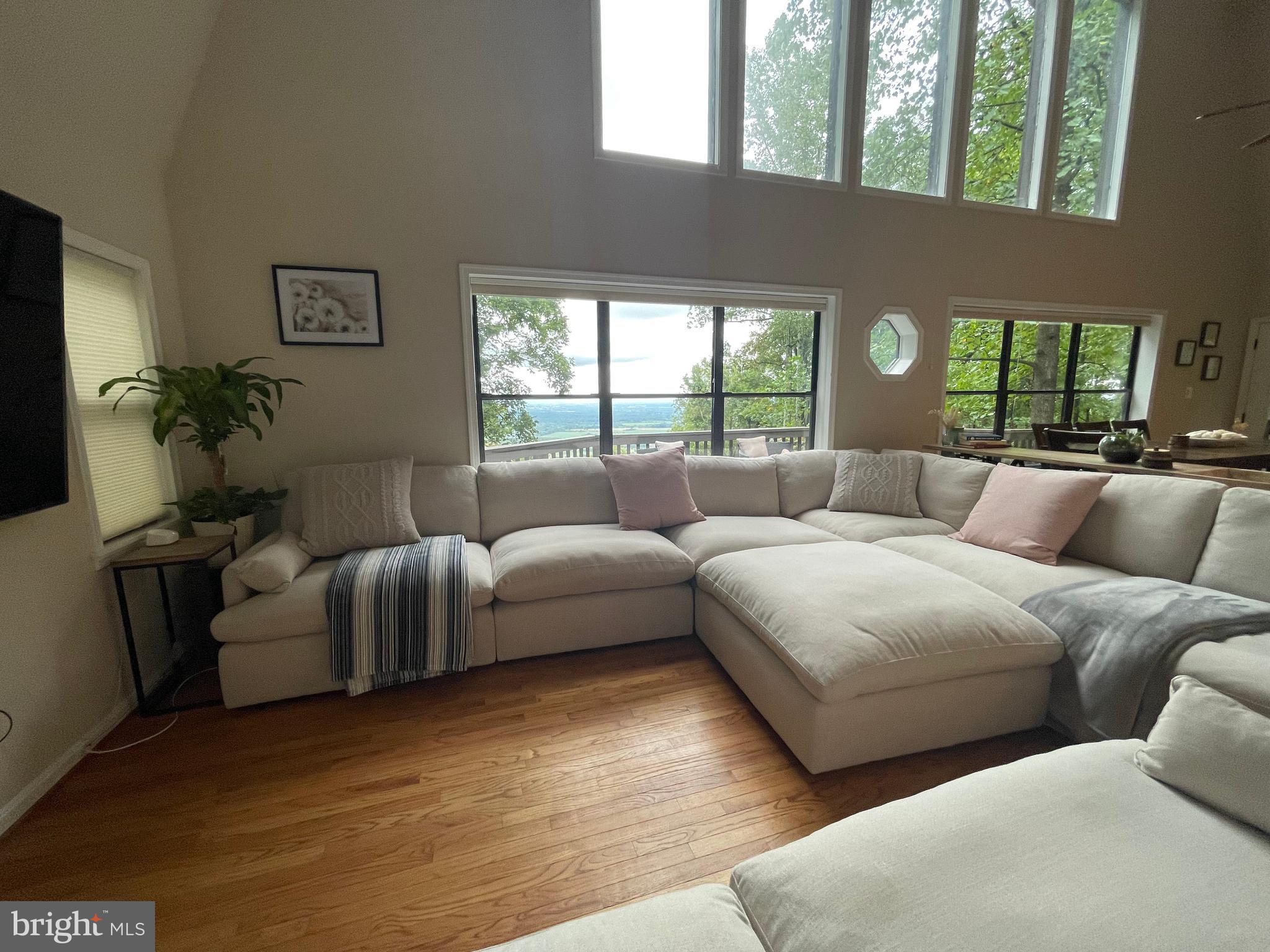 2315 Lookout Road Haymarket, VA 20169 - Photo 8 of 36 a living room with furniture and windows