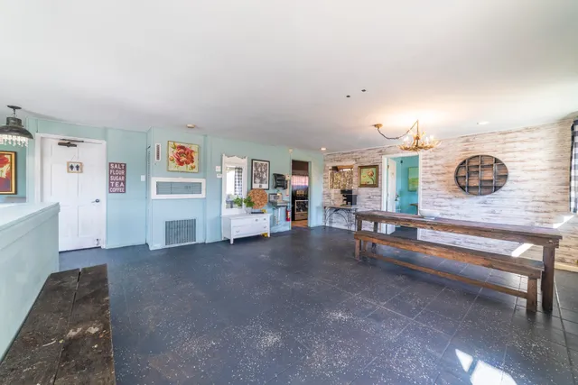 a bathroom with a sink mirror vanity and toilet