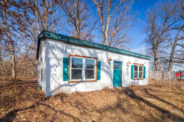 front view of a house with a trees