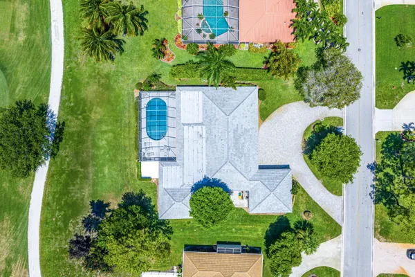 $945,000 | 489 South Country Club Drive, Atlantis, FL 33462