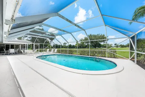 a view of a swimming pool with a porch
