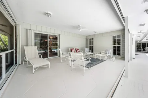 a living room with furniture and flat screen tv