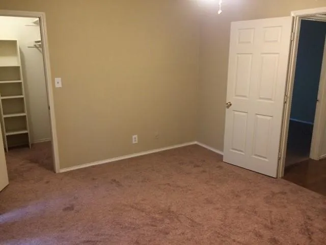 a view of a bathroom from a hallway