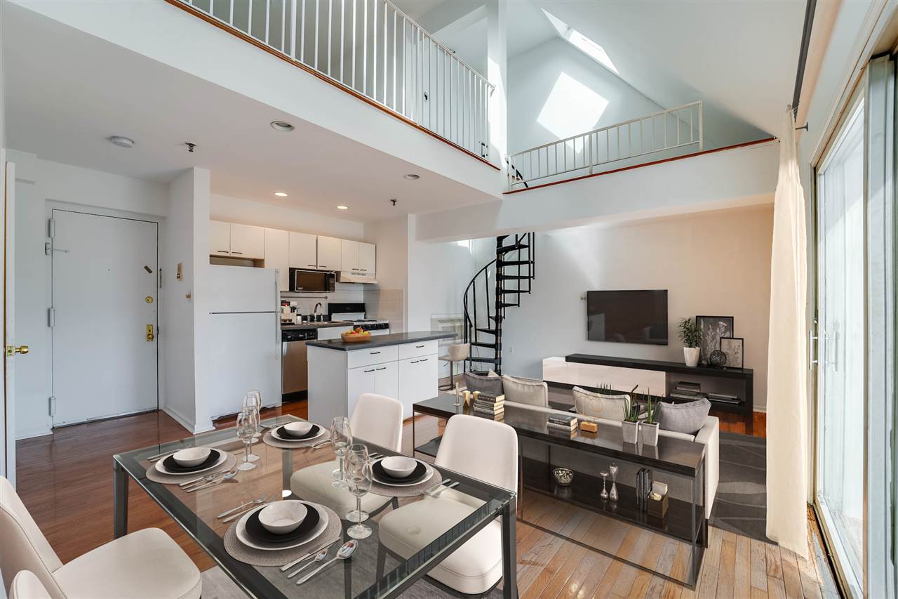 130 Madison Street, Unit 7 Hoboken, NJ 07030 - Photo 1 of 1 a living room with furniture and a flat screen tv