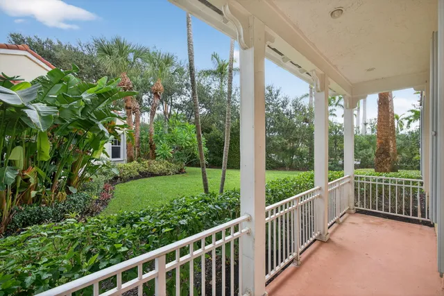 a view of a garden from a balcony