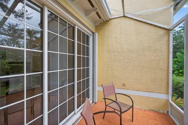 a view of a balcony with furniture