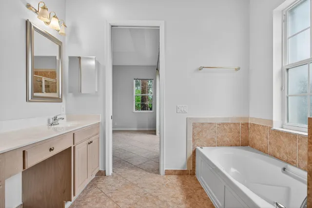 a bathroom with a tub and shower