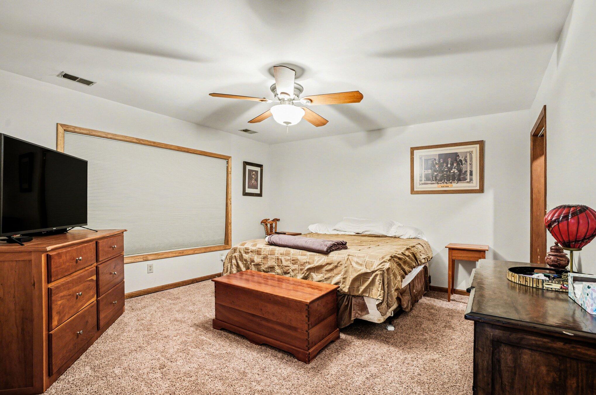 754 South Forrester Road La Porte, IN 46350 - Photo 11 of 33 a bedroom with a bed and a flat screen tv