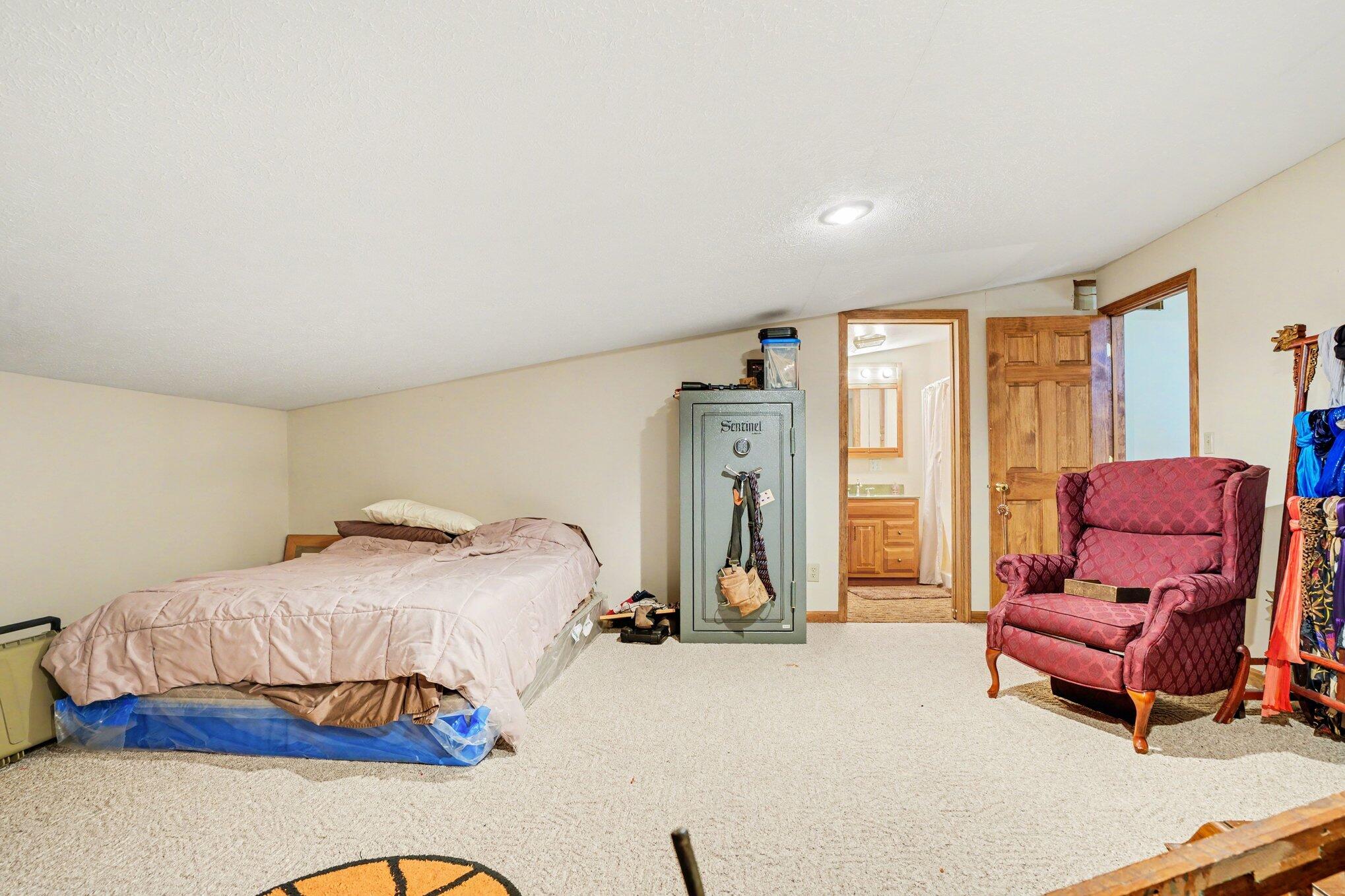 754 South Forrester Road La Porte, IN 46350 - Photo 13 of 33 a bedroom with furniture and a bathtub