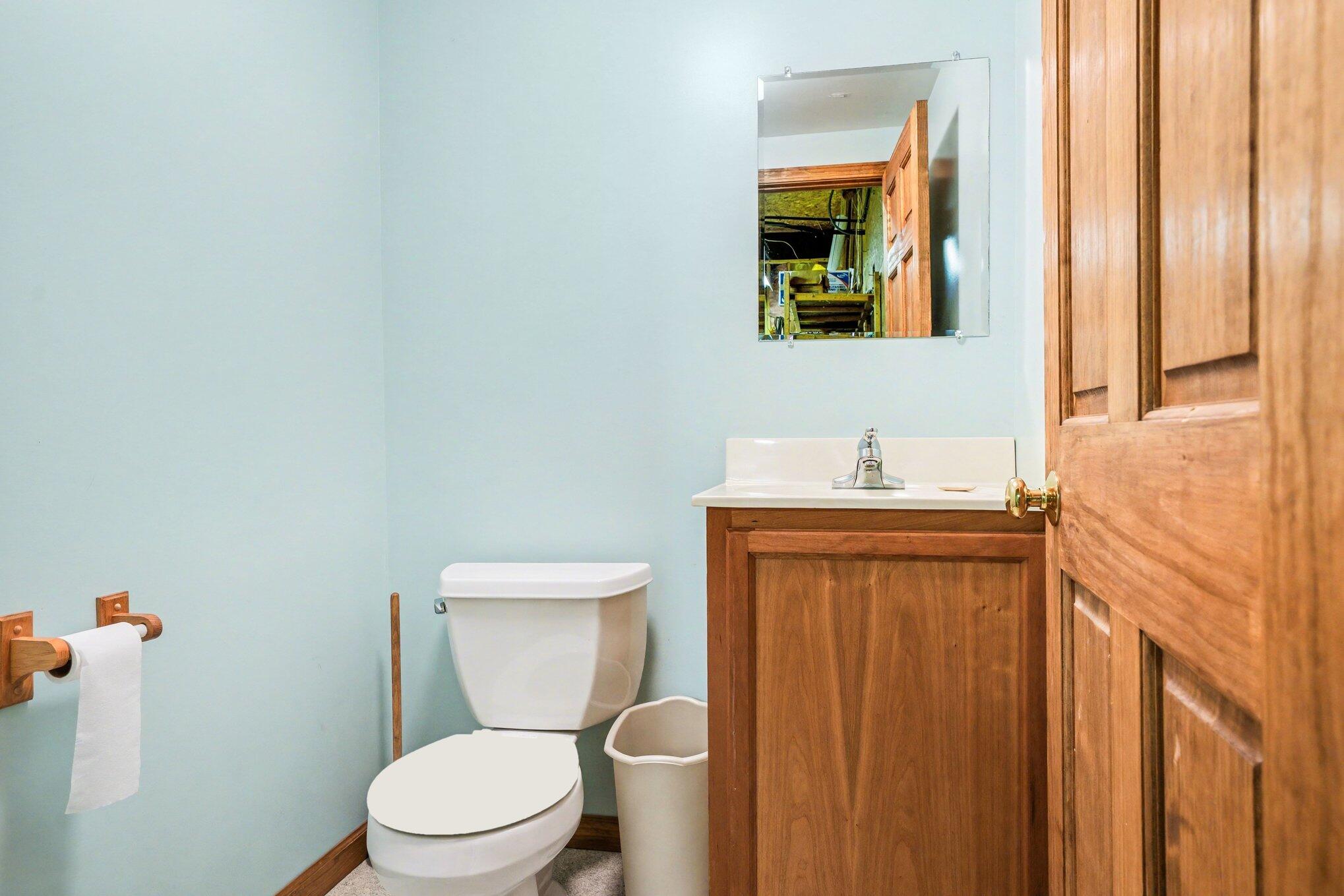 754 South Forrester Road La Porte, IN 46350 - Photo 16 of 33 a bathroom with a toilet a sink and mirror