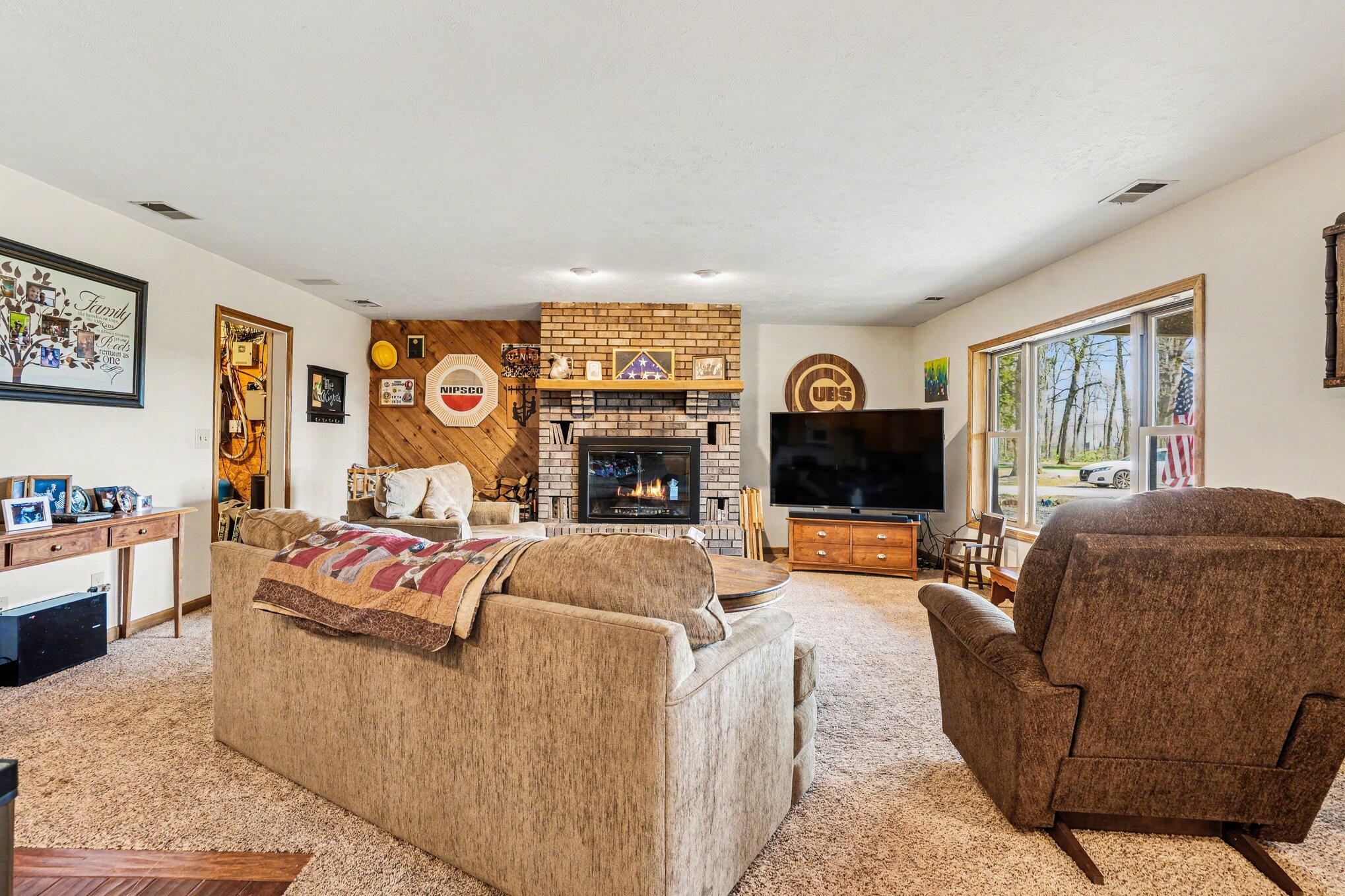 754 South Forrester Road La Porte, IN 46350 - Photo 7 of 33 a living room with fireplace furniture and a flat screen tv