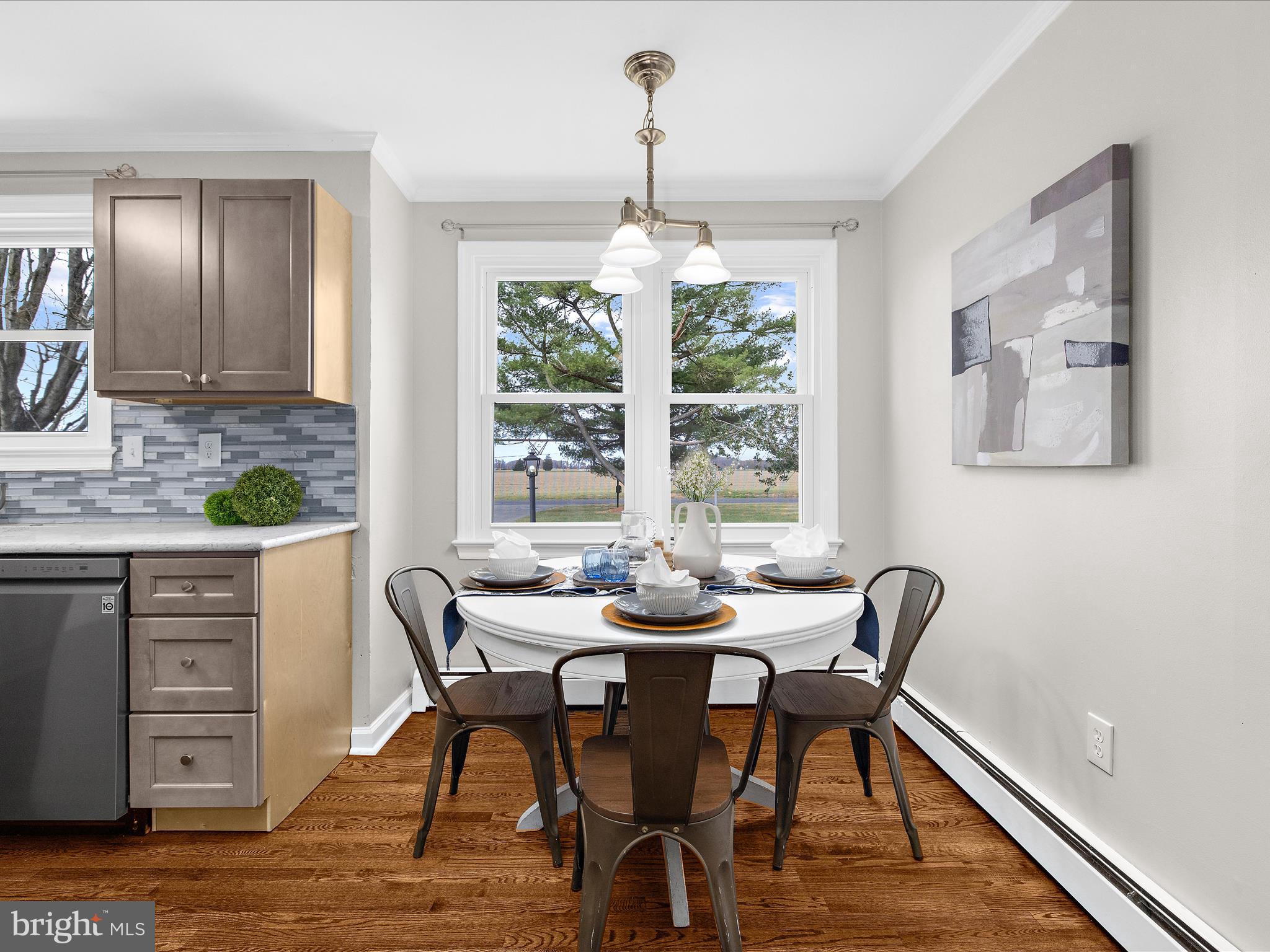 208 Ewingtown Road Church Hill, MD 21623 - Photo 11 of 62 a dining room with furniture a window and wooden floor