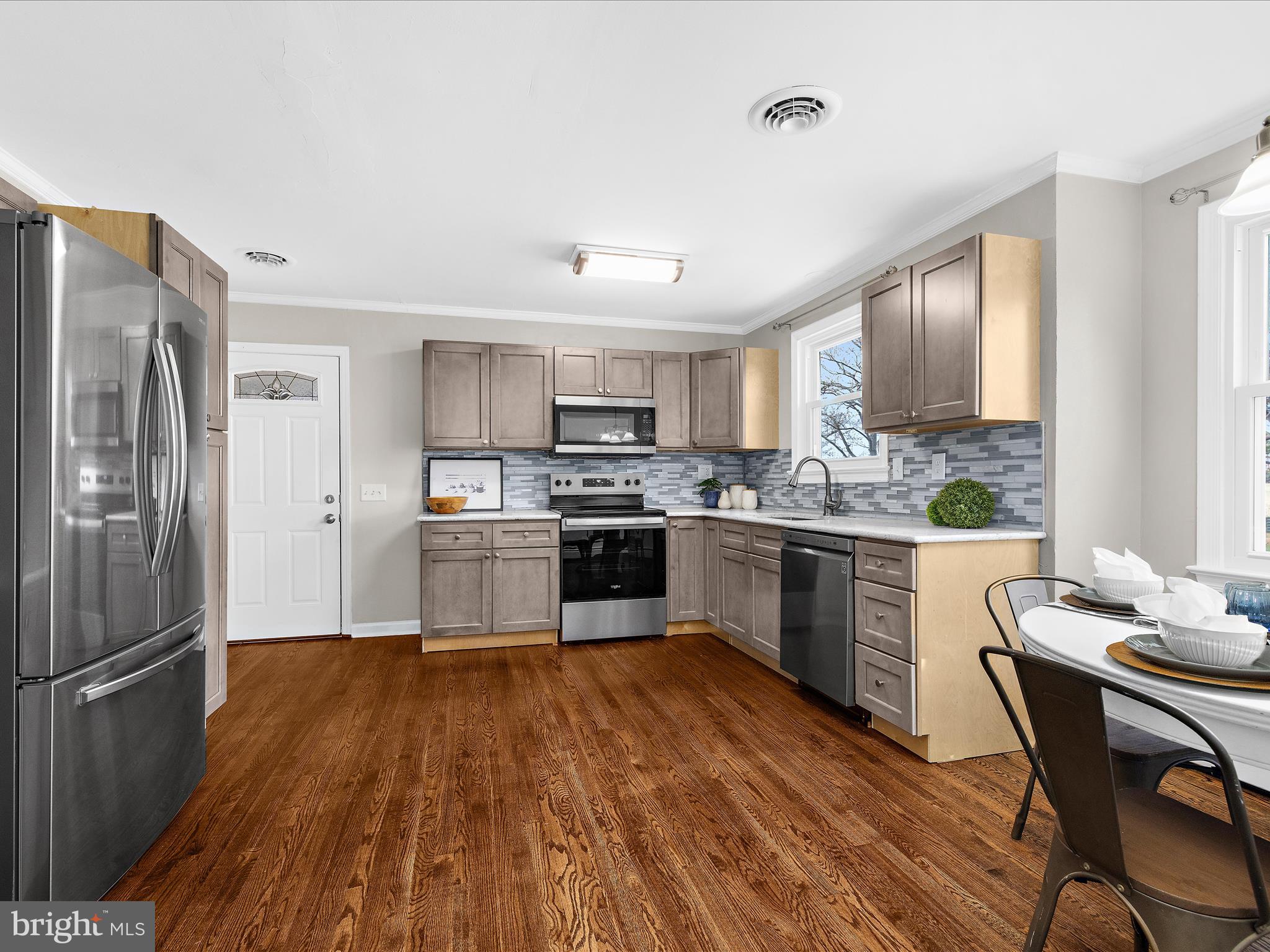 208 Ewingtown Road Church Hill, MD 21623 - Photo 12 of 62 a kitchen with a refrigerator a sink dishwasher stove and oven
