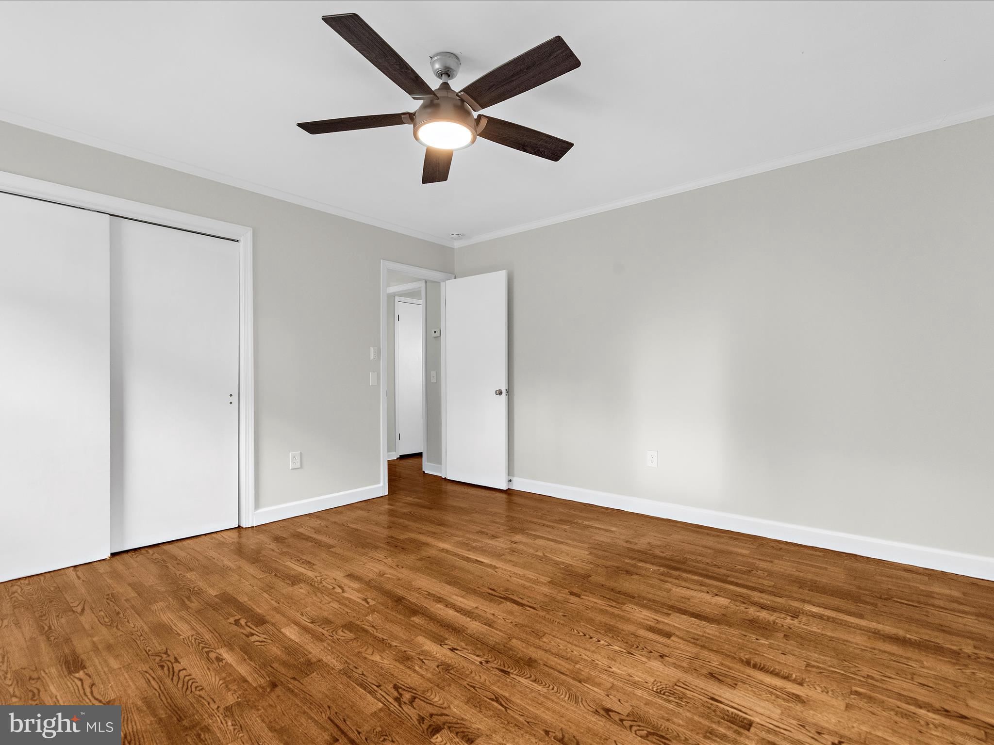 208 Ewingtown Road Church Hill, MD 21623 - Photo 15 of 62 an empty room with wooden floor and windows