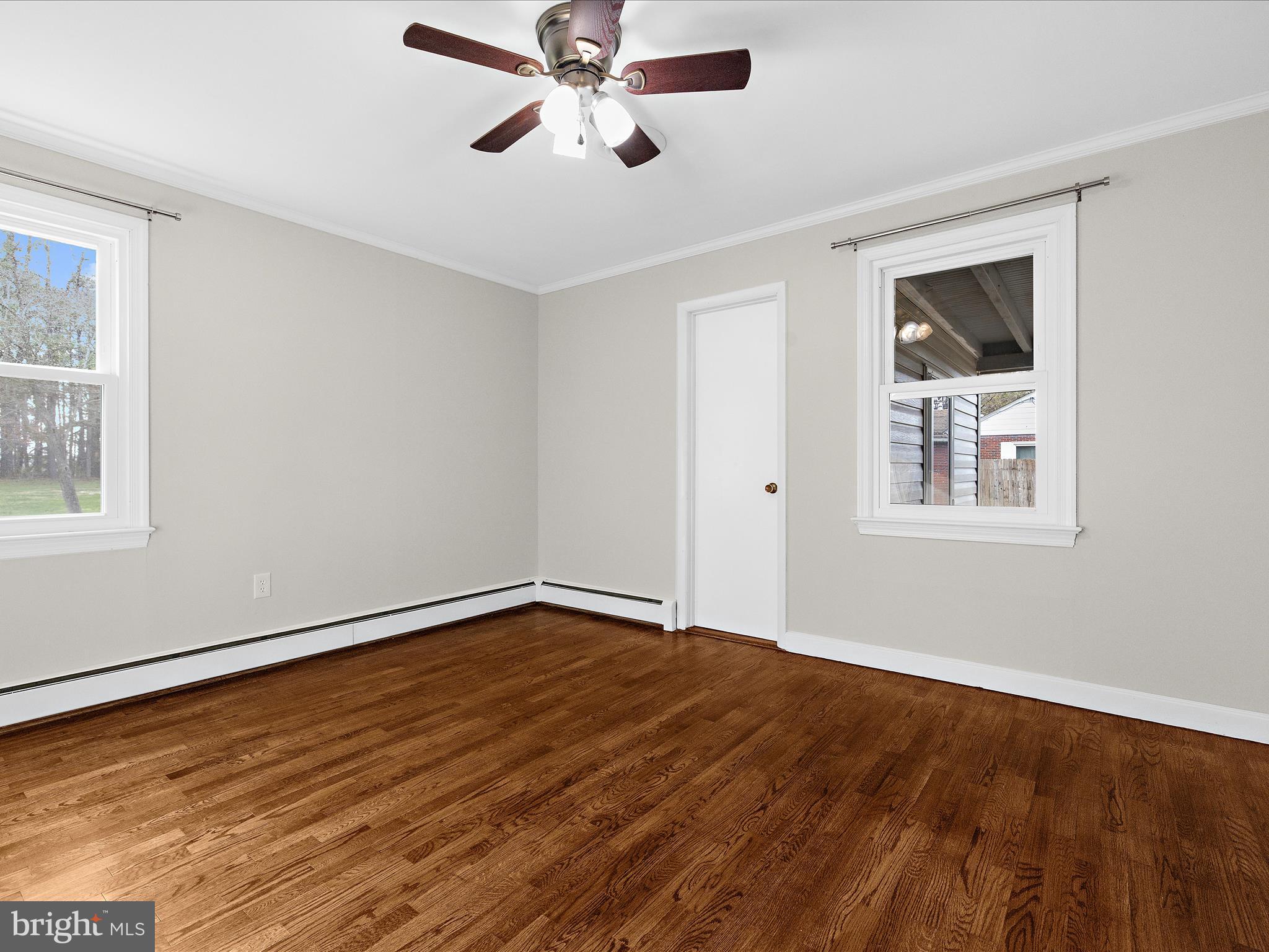 208 Ewingtown Road Church Hill, MD 21623 - Photo 21 of 62 a view of an empty room with wooden floor and a window