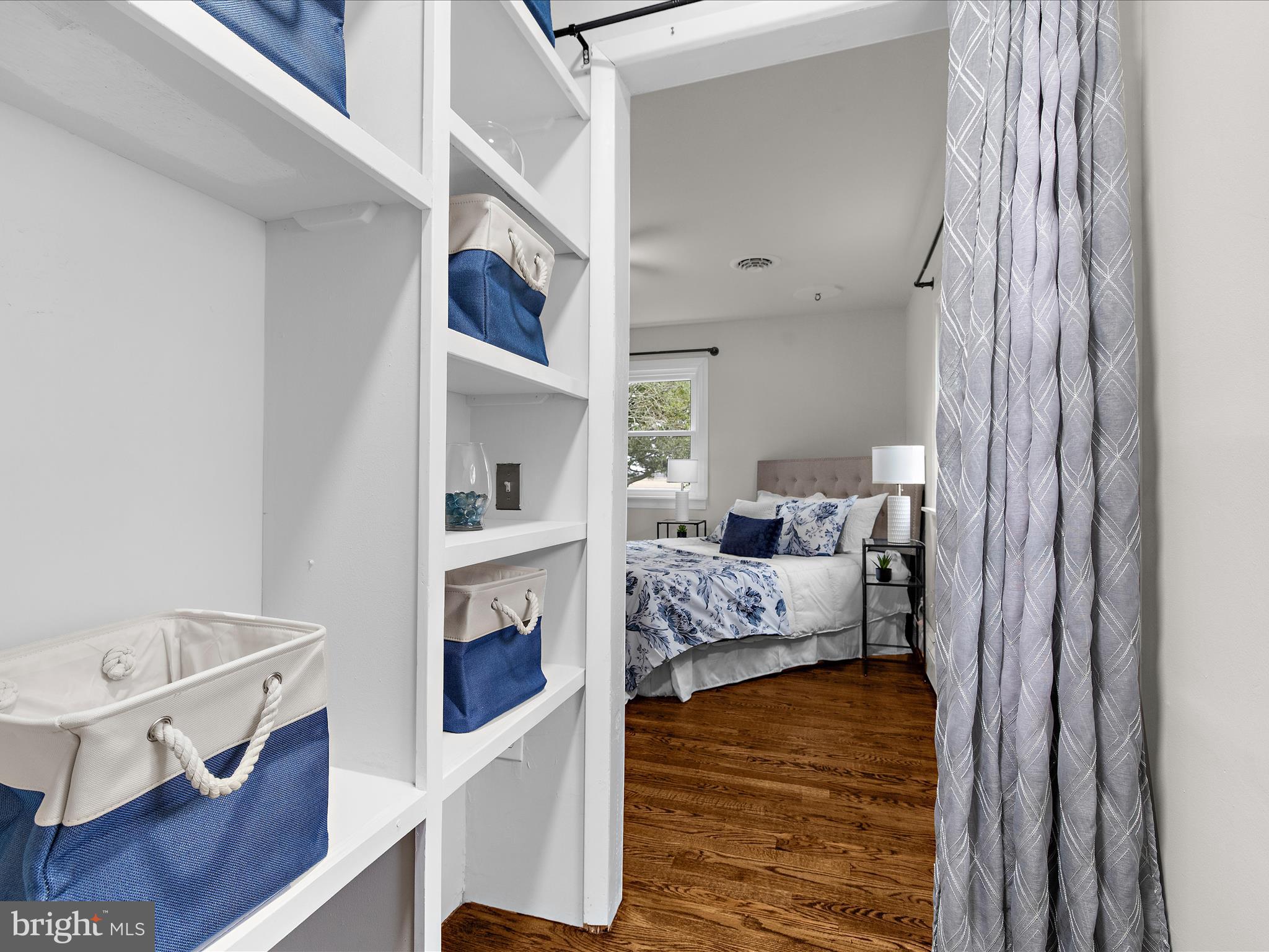 208 Ewingtown Road Church Hill, MD 21623 - Photo 27 of 62 a bedroom with furniture and a wooden floor