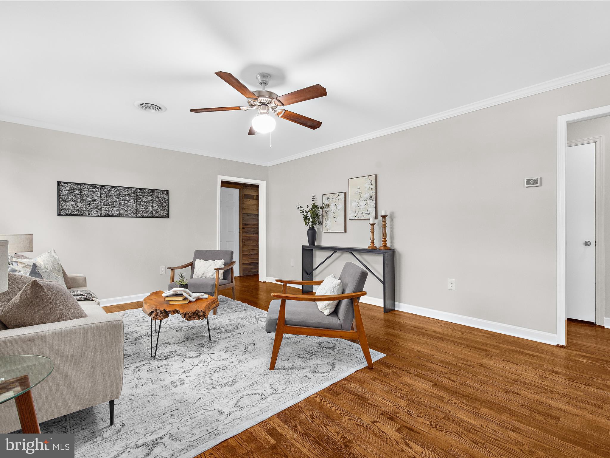 208 Ewingtown Road Church Hill, MD 21623 - Photo 7 of 62 a living room with furniture and a wooden floor