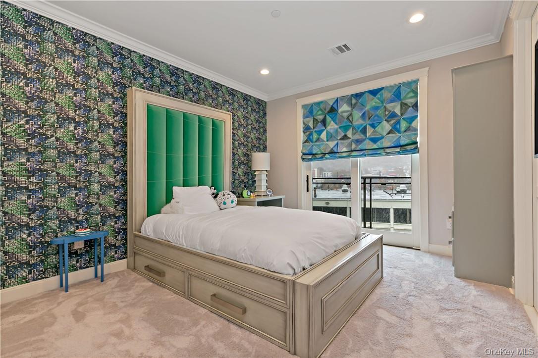 45 Hudson View Way Tarrytown, NY 10591 - Photo 14 of 26 a bed sitting in a spacious bedroom next to a window