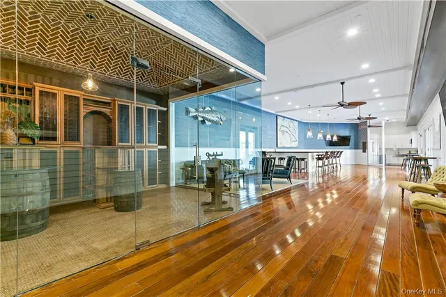 a view of a patio with table and chairs with wooden floor and fence